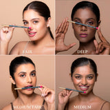 Four women demonstrating makeup application with a pencil, labeled 'Fair', 'Deep', 'Medium Fair', and 'Medium'.