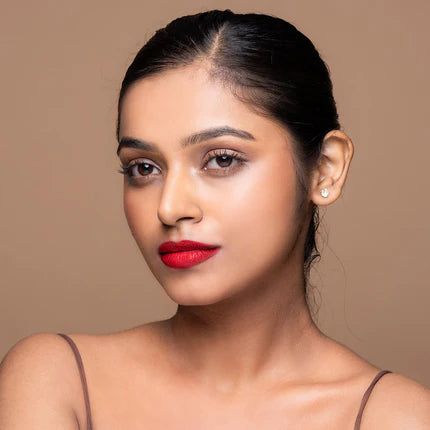 Woman with red lipstick and a neutral background