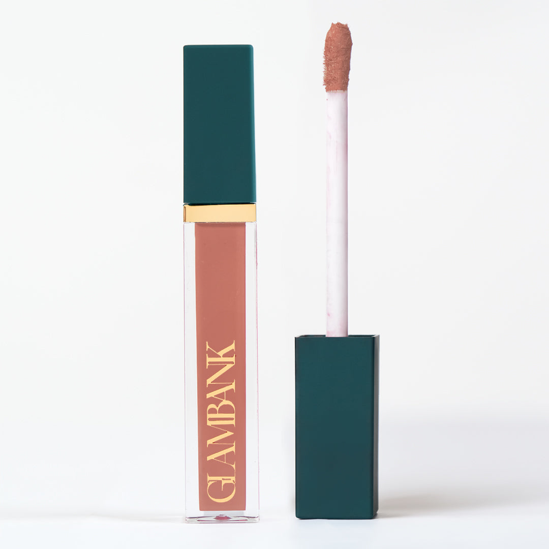 A tube of matte lipcolor in a brown shade with a twist-up applicator, branded with 'GLAMBANK'.