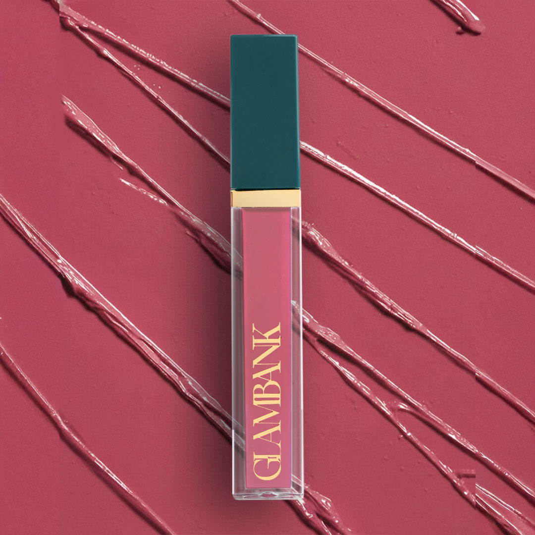 Lipstick with teal cap and pink body on a matching background